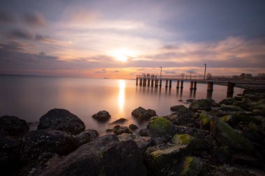 Sunset in Florya and people by sea side.