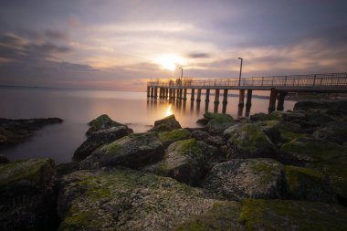 Sunset in Florya and people by sea side.