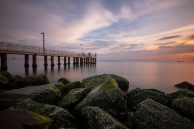 Sunset in Florya and people by sea side.