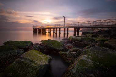 Sunset in Florya and people by sea side.