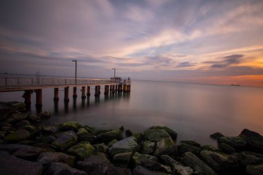 Sunset in Florya and people by sea side.