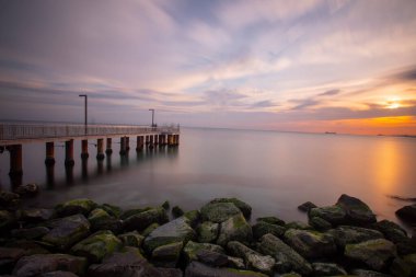 Sunset in Florya and people by sea side.