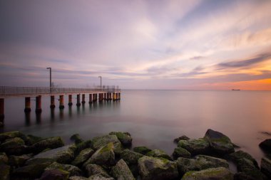 Sunset in Florya and people by sea side.