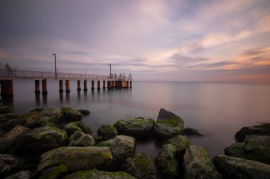 Sunset in Florya and people by sea side.