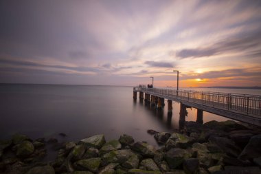 Sunset in Florya and people by sea side.