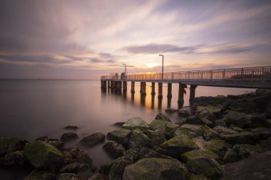 Sunset in Florya and people by sea side.