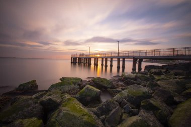 Sunset in Florya and people by sea side.