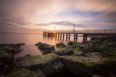 Sunset in Florya and people by sea side.