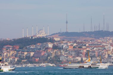 Panoramic view of the Anatolian side of the bosphorus taken across the strait from European side. Photo features, sea, Camlica mosque, ferry, Camlica tower,