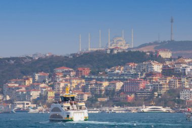 Panoramic view of the Anatolian side of the bosphorus taken across the strait from European side. Photo features, sea, Camlica mosque, ferry, Camlica tower,