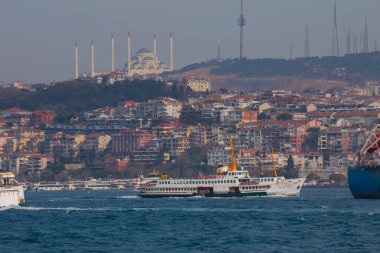 Panoramic view of the Anatolian side of the bosphorus taken across the strait from European side. Photo features, sea, Camlica mosque, ferry, Camlica tower,