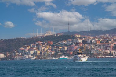 Panoramic view of the Anatolian side of the bosphorus taken across the strait from European side. Photo features, sea, Camlica mosque, ferry, Camlica tower,