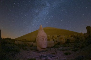 Ancient statues on the Nemrut mountain on the beautiful. Milky way galaxy. Unesco heritage. Nemrut, Turkey. Night landscape.