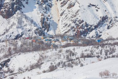 Winter Landscape with Small Village Houses Between Snow Covered Forest in Cold Mountains. Giresun - Turkey