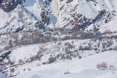 Winter Landscape with Small Village Houses Between Snow Covered Forest in Cold Mountains. Giresun - Turkey