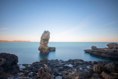 In the middle of a large stone sea, photographed with long exposure technique