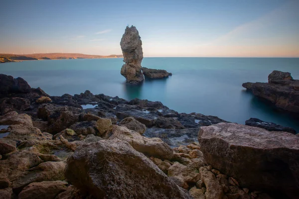 In the middle of a large stone sea, photographed with long exposure technique