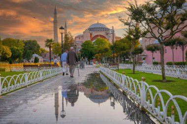 Hagia Sophia is an ancient religion landmark of Istanbul on sunset. Panoramic view on Turkish Mosque with foth minarets. Ayasofya was the greatest Christian temple of Byzantium Empire. clipart