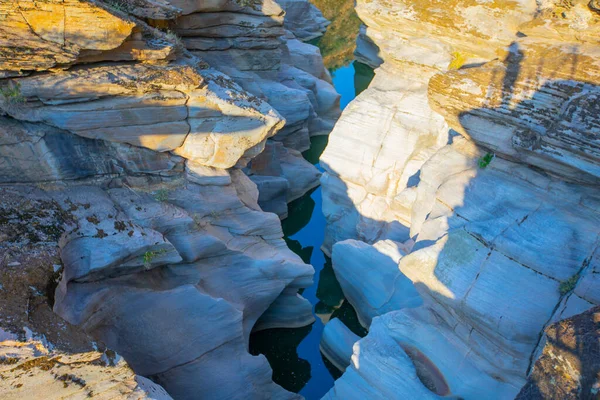 Stock image Tasyaran canyon, which attracts attention with its rock shapes similar to Antelope canyon in Arizona, offers a magnificent view to its visitors. Canyon view and stream at sunset.