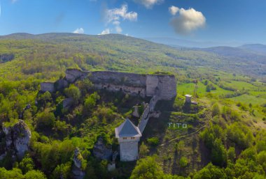 The magnificent panoramic view of the mountain valley of Una river and traditional village Kulen Vakuf from the top of Ostrovica castle clipart