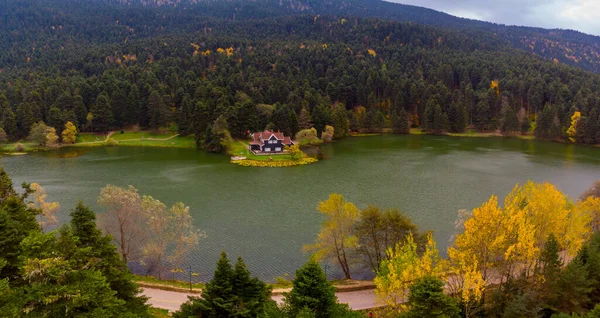 stock image Aerial view of wooden Lakehouse inside the forest in Bolu Golcuk National Park.Bolu Aerial Photo, Turkey. Shooting with drone