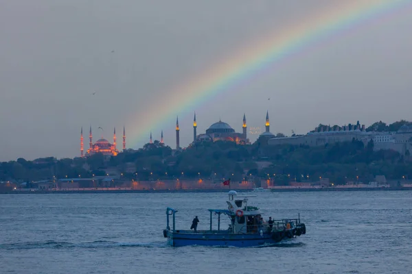 stock image Historical peninsula and old istanbul ferries , sunset time