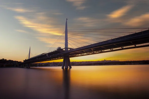 stock image New Halic Metro Bridge at summer night blue sky and city lights in Istanbul, Turkey