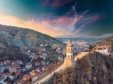 The Victory Tower (Zafer Kulesi) with the traditional houses in the background. Goynuk, Bolu, Turkey. Shooting with drone
