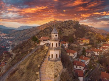 The Victory Tower (Zafer Kulesi) with the traditional houses in the background. Goynuk, Bolu, Turkey. Shooting with drone