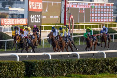 Riders compete in the Istanbul Horse Race at Veliefendi Race Track. clipart