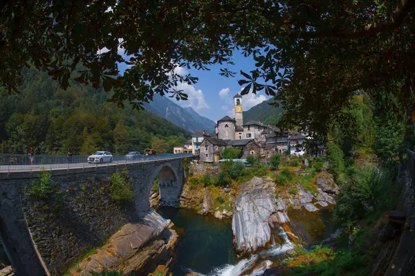 stock image Traditional stone houses and a Church in the picturesque Lavertezzo village, Ticino, Switzerland. Lavertezzo is a popular travel destination in Verzasca valley in the swiss Alps mountains.