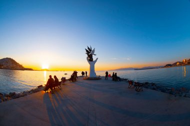 Hand of peace sculpture with doves on the waterfront in Kusadasi.