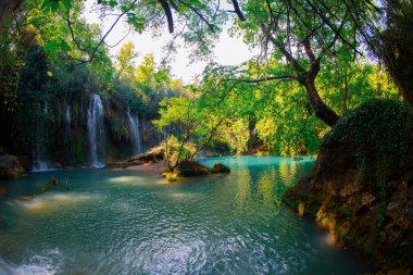 Beautiful waterfalls over emerald water in deep green forest in Kursunlu Natural Park, Antalya, Turkey