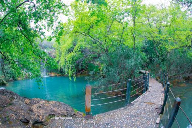 Beautiful waterfalls over emerald water in deep green forest in Kursunlu Natural Park, Antalya, Turkey