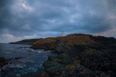 Lighthouse and cliffs in the Black Sea. View of Inceburun lighthouse. The northernmost point of Turkey. Sinop, Turkey clipart