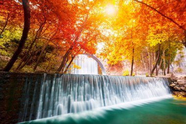 The old stone, arched bridge, between two waterfalls in Palaiokaria, Trikala prefecture, Thessaly, Greece.