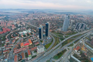 an aerial view of construction of syscraper from saphire roof clipart