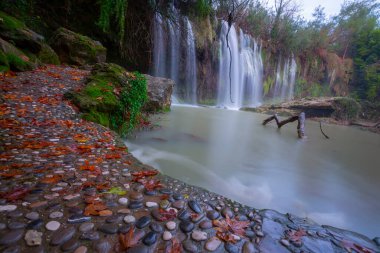 Kursunlu Waterfall is a waterfall that can be reached by turning left at the 24th km of the Antalya-Isparta highway and continuing for 7 km. clipart