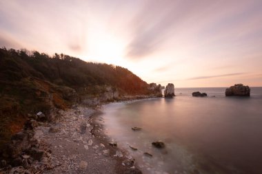 The magnificent color of the sea of Kilim Bay, the natural wonder of Ava, which is the subject of unique photographs, and the unique rock formations clipart