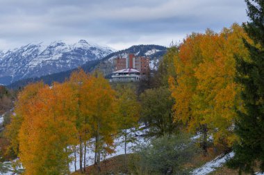 A beautiful building in the middle of autumn. clipart