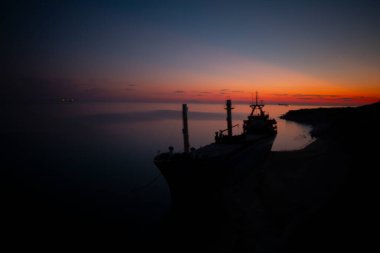 A large ship washed ashore in Bozcaada, Canakkale clipart