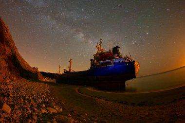 A large ship washed ashore in Bozcaada, Canakkale clipart