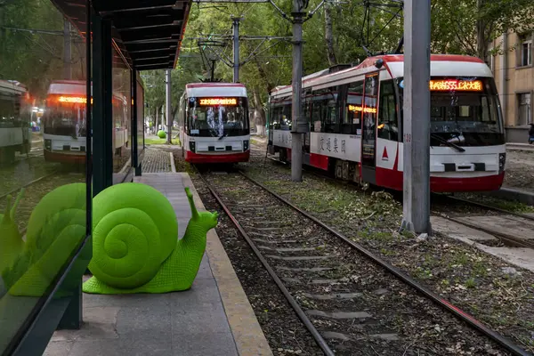 stock image On June 16, 2023, in Changchun, China, a group of green snail arts was exhibited at Route 54 Tram Station. These snails come from Italy, adding a beautiful landscape to Changchun's summer.