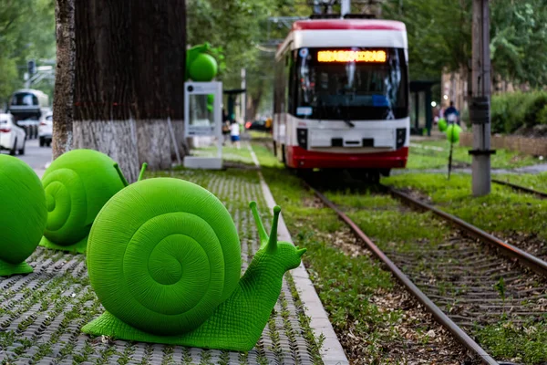 stock image On June 16, 2023, in Changchun, China, a group of green snail arts was exhibited at Route 54 Tram Station. These snails come from Italy, adding a beautiful landscape to Changchun's summer.