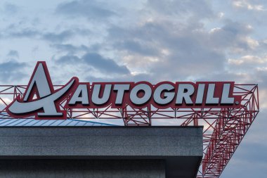 Genoa, Italy - November 14, 2021: Autogrill sign above the entrance to a highway restaurant. Multinational catering company runs operations in 30 countries in Europe and North America clipart