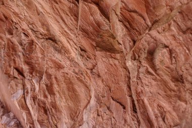 Natural stone texture of red iron oxide rocks clipart
