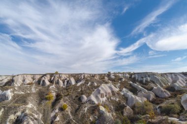 Dwellings carved in stone, in volcanic rock formations eroded by water in the open air museum in Cappadocia, Anatolia, Turkey