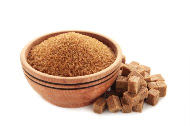 Brown sugar cubes with bawl isolated on white background. Top view