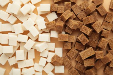 Brown and white sugar cubes background. Top view