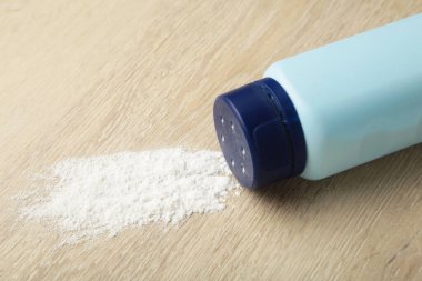 Baby powder on light background. Baby cosmetics. Top view